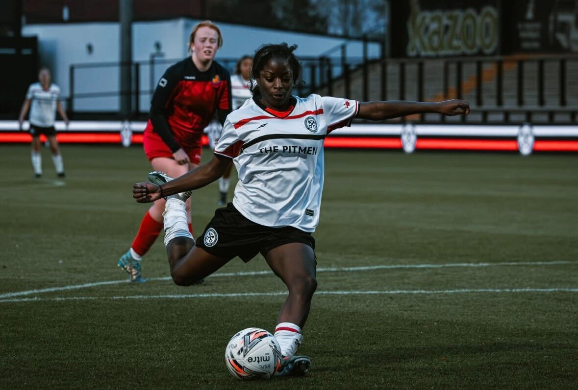 Female player hitting the ball