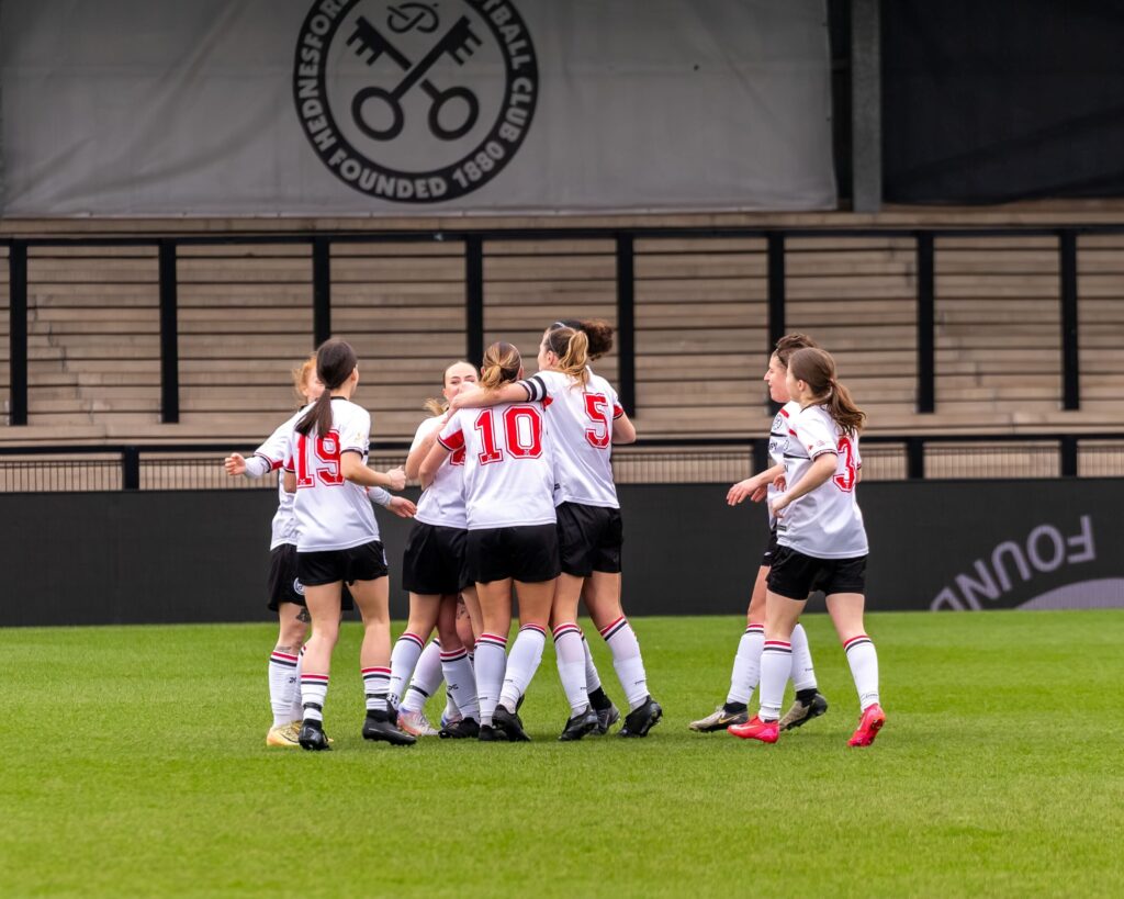 Ladies players celebrating at Keys Park